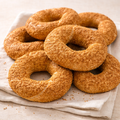 Sesame seeded 6 turkish bagels (simit) on a white cloth